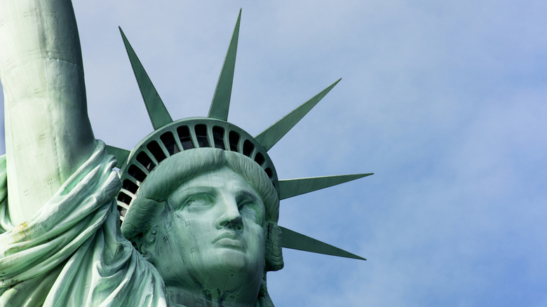 close up on the face of teh statue of liberty