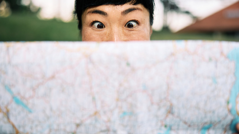 A woman reading a map