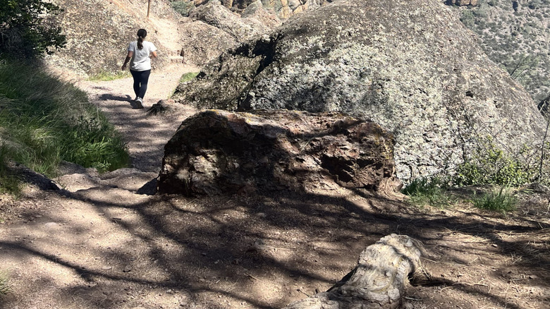 A young woman (the author) hiking on the High Peaks Trail at Pinnacles National Park.