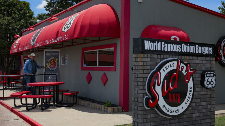 A customer enters Sid's Burger Diner, which sits along historic Route 66 in El Reno, Oklaoma