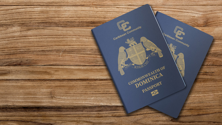 Dominica passports on a wooden surface
