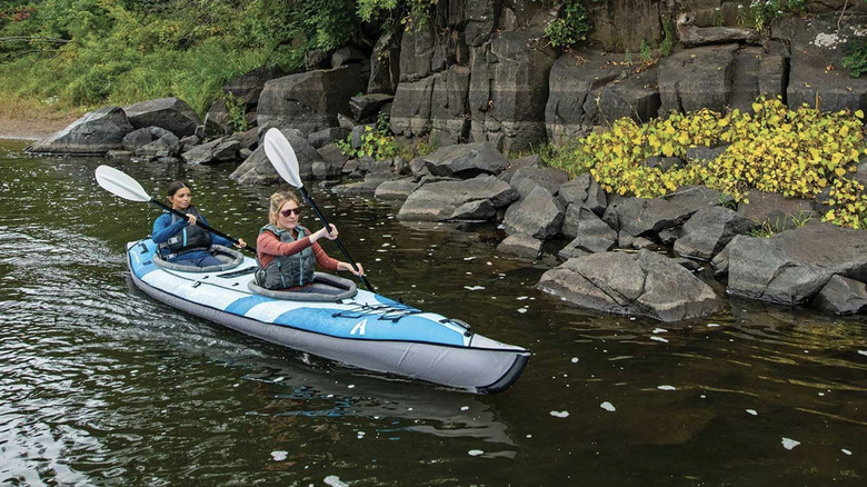 Woman and girl paddling in a kayak