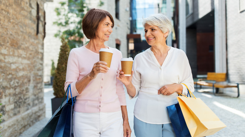 Two mature women walking in a Tallinn city street