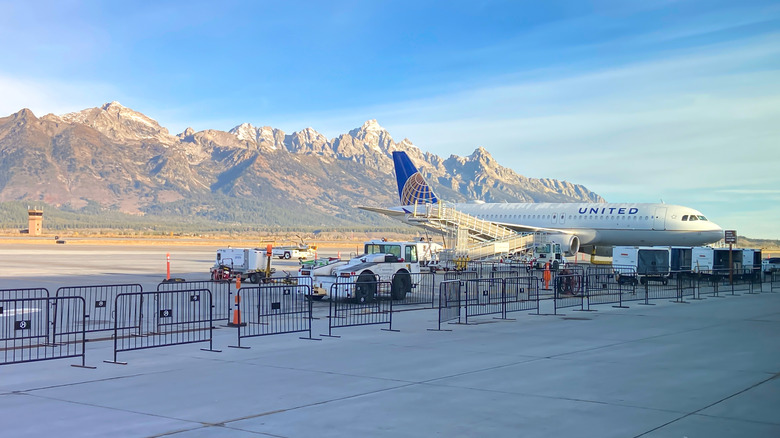A United airplane awaits passenger loading at Jackson Hole Airport in Wyoming