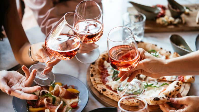 People toasting over dinner