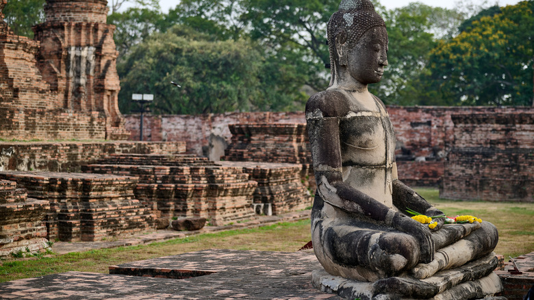 A Buddha statue at Wat Mahathat in Ayutthaya, Thailand