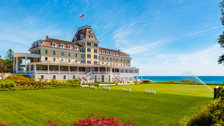 Ocean House in Westerly, Rhode Island, overlooking its expansive oceanfront lawn on a bright day