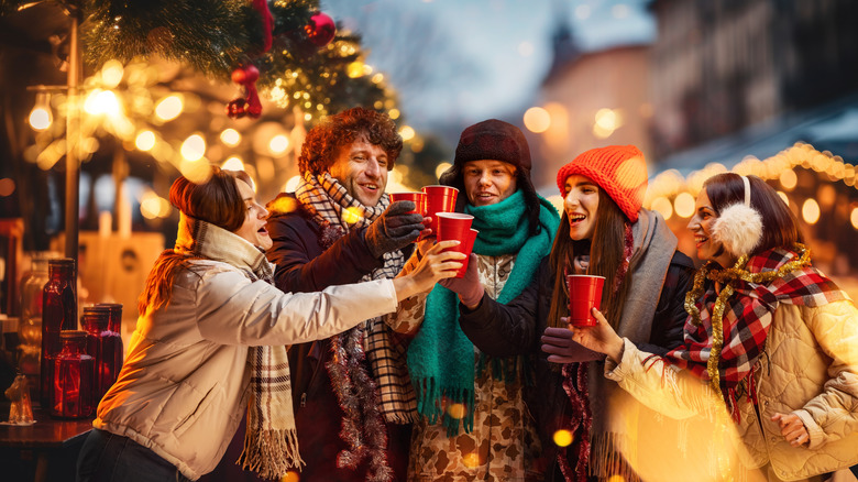 A group of friends enjoy a Christmas market