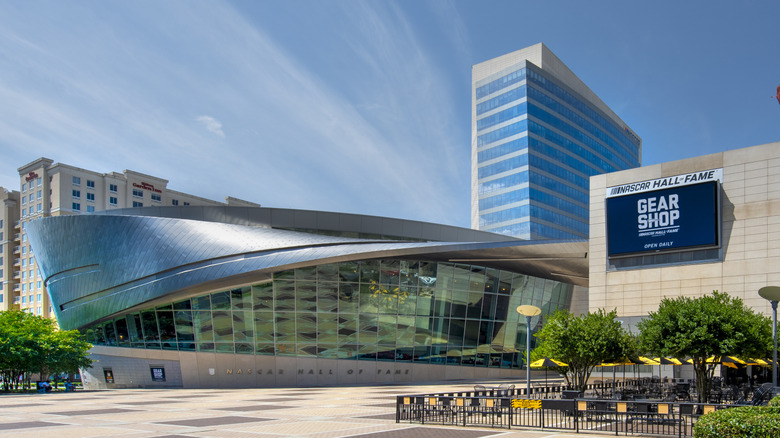 Smooth steel and glass exterior of the NASCAR Hall of Fame building in Charlotte, North Carolina