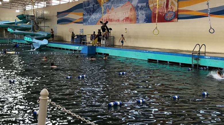 A pool with rings and slides at Evans Plunge Mineral Springs