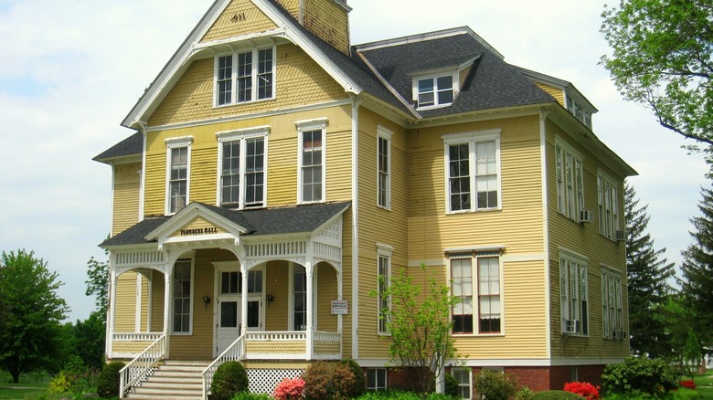 Yellow wooden Founder's Hall at Atlantic Union College