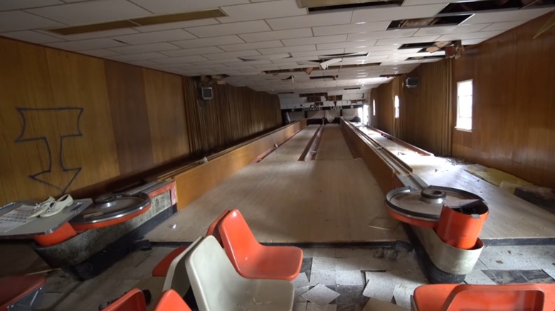 Abandoned bowling alley with graffiti and broken floor Birchwood Resort