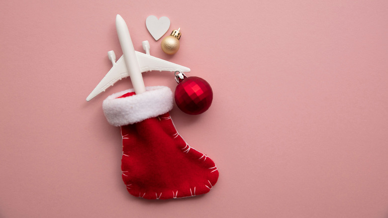 Christmas stocking with a plane and ornaments