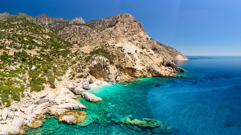 Turquoise blue water white cliffs Seychelles Beach Ikaria