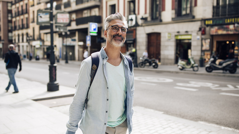 A mature man walking in Madrid