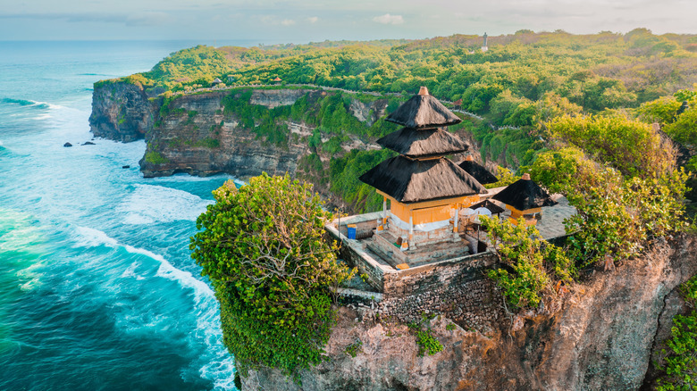 Uluwatu Temple perched on the edge of a cliff in Uluwatu, Bali