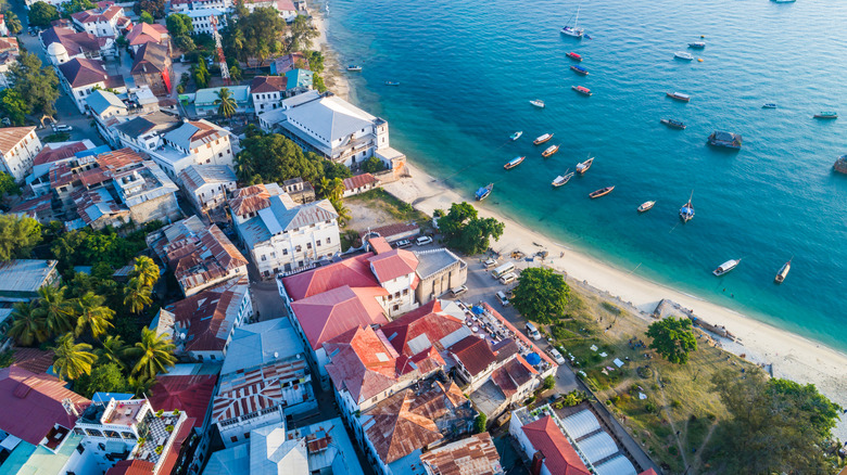 Aerial view of Stone Town and the beach in Zanzibar with clear water