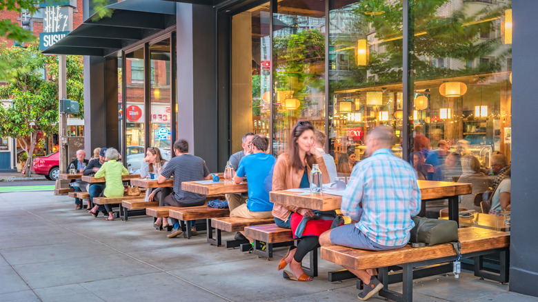 People dining on patio restaurant in Portland, OR