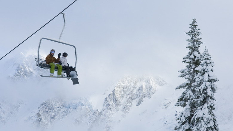 Skiers and snowboarders riding lift at Mount Baker in Washington