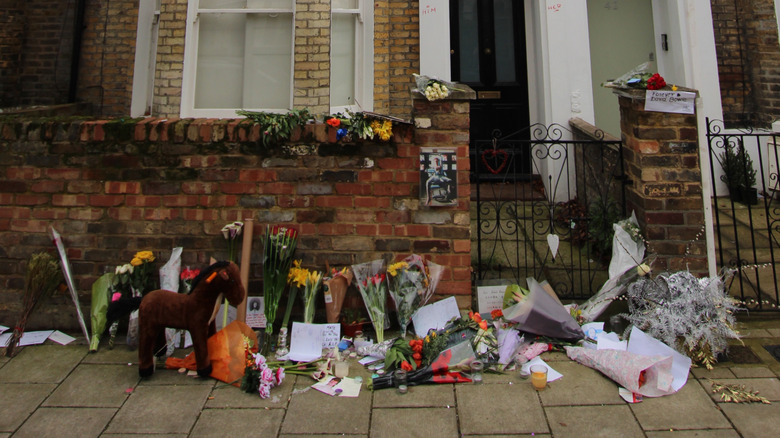 Flowers laid outside the front of Bowie's childhood home in Brixton.
