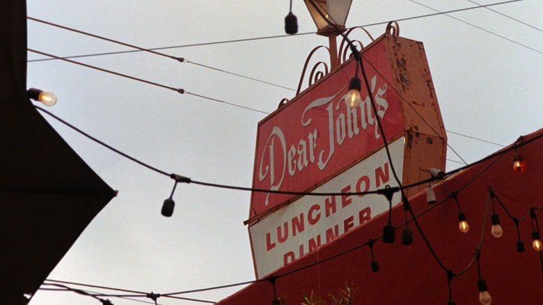 Dear John's sign, with bulb lights hanging in front