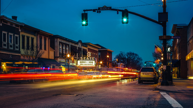 State Street in uptown Westerville Ohio at night, with buildings lining a street with time-lapsed brake lights