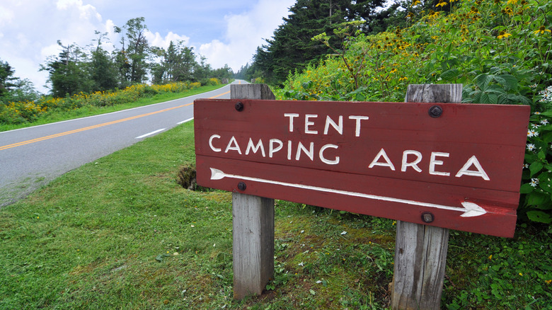 Tent camping area sign by roadside