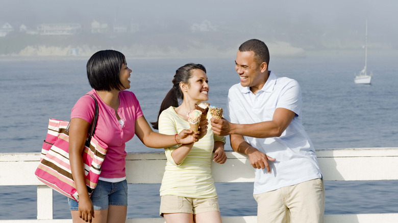 People holding ice cream cones on the Santa Cruz Wharf