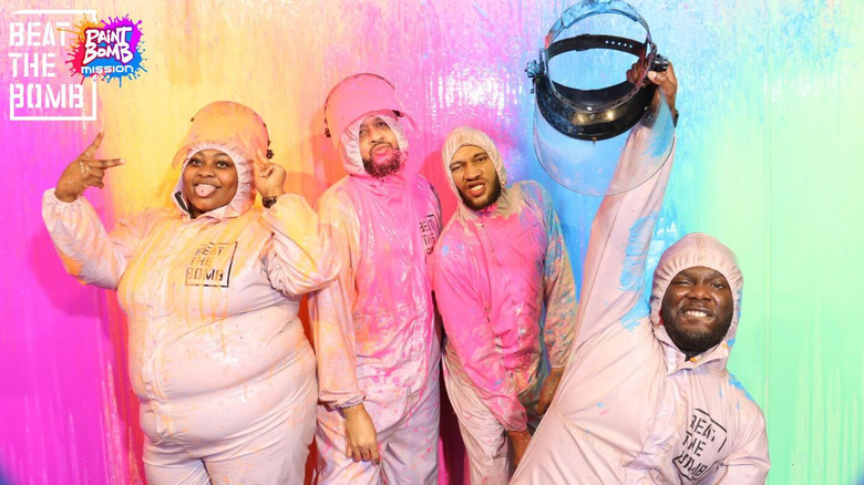 A group covered in paint from Beat the Bomb