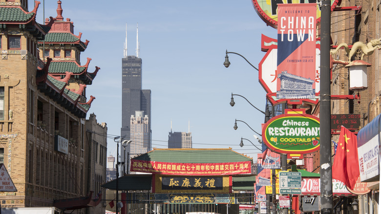 Chicago, Illinois, USA - September 26, 2019: Chinatown and the Pui Tak Center during day time, with the Willis Tower in the distance, as viewed from the oldest part of Chicago's Chinatown.