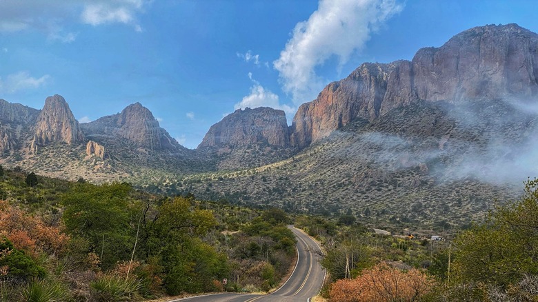 A winding, two-lane road takes park visitors into the Chiso Mountains in Big Bend National Park, Texas.