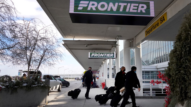 Passengers arriving at the airport outside