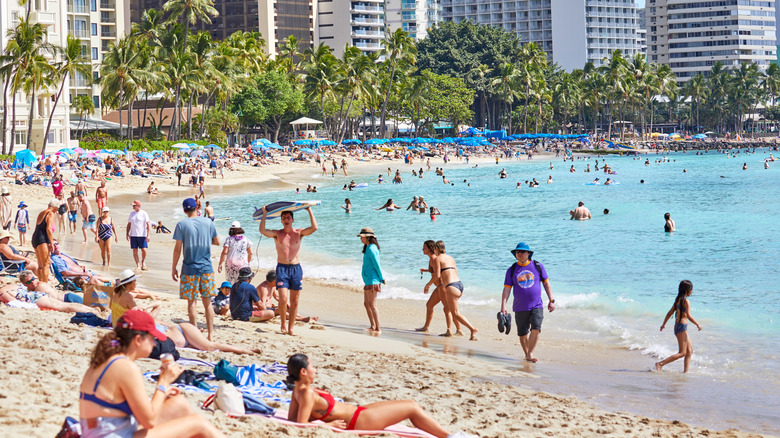 A crowded Waikiki Beach full of people during February