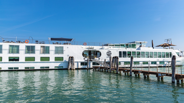 Uniworld River Cruises hotel-like cruise ship docked in Italy