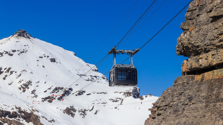 A cable car rises to a village in Switzerland
