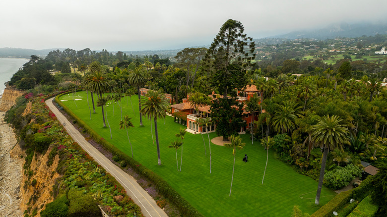 Aerial view of a secluded, coastal cliffside mansion in Montecito, California