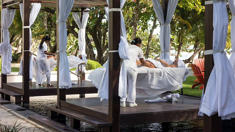 outdoor spa area with masseuses offering services at Casa Colonial in Dominican Republic