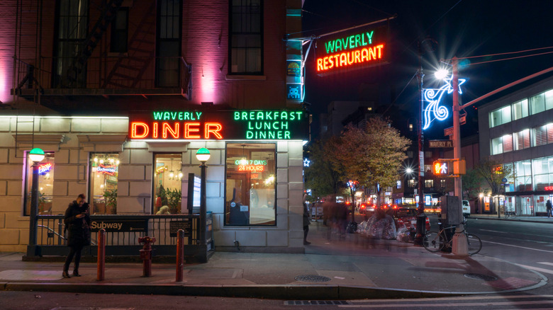 Waverly Diner neon signs light up Waverly Pl at night