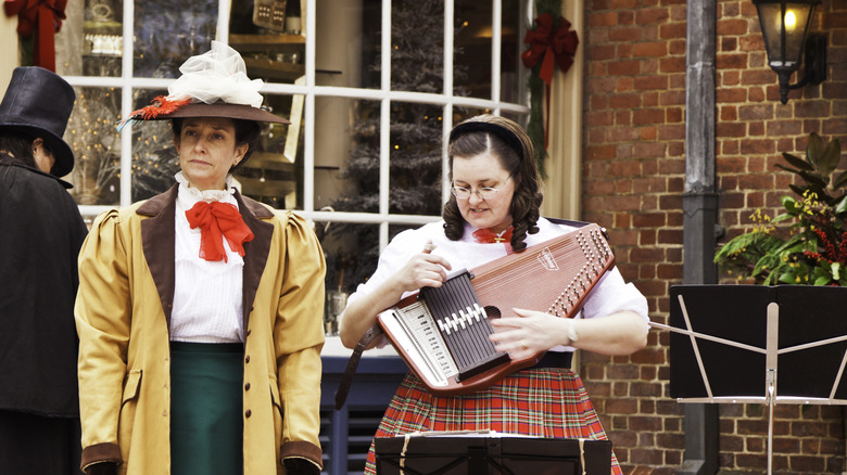 Carolers dressed in period costumes at Christmastime in Williamsburg