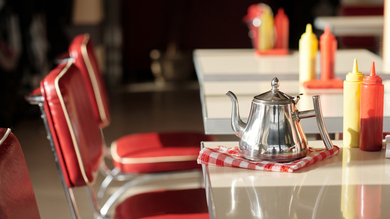Retro diner tables with coffee pot, ketchup, and mustard