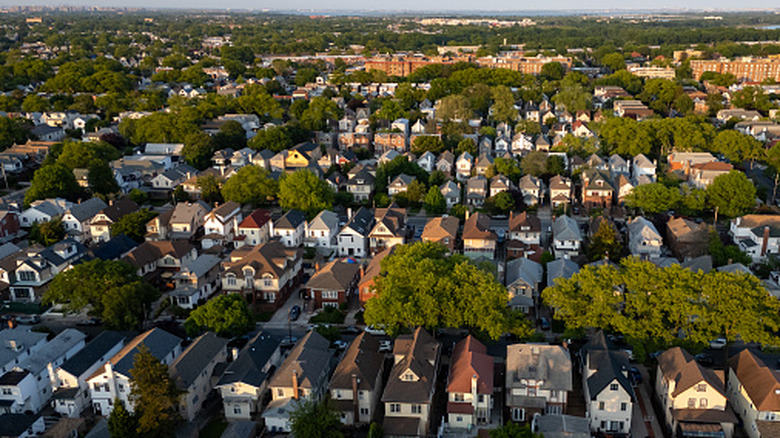 An aerial look at a suburban area of Chicago, IL with plenty of houses and trees