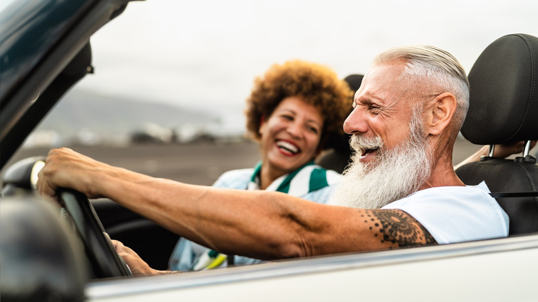 Happy senior couple traveling