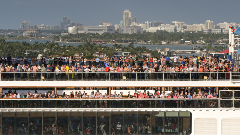 People on a very crowded cruise ship