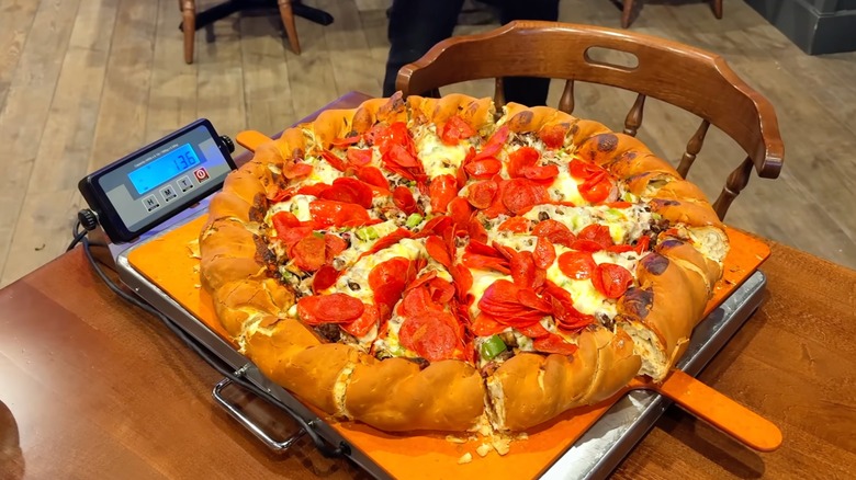 Mountain Man challenge pizza from Beau Jo's on a scale