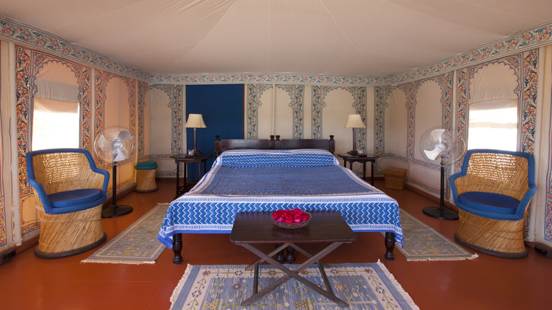 A bed in a glamping tent in Rajasthan
