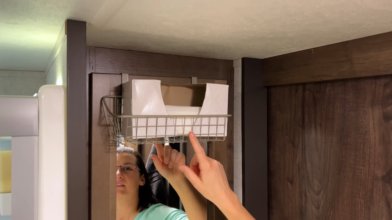 Hanging wire basket over the door for storage