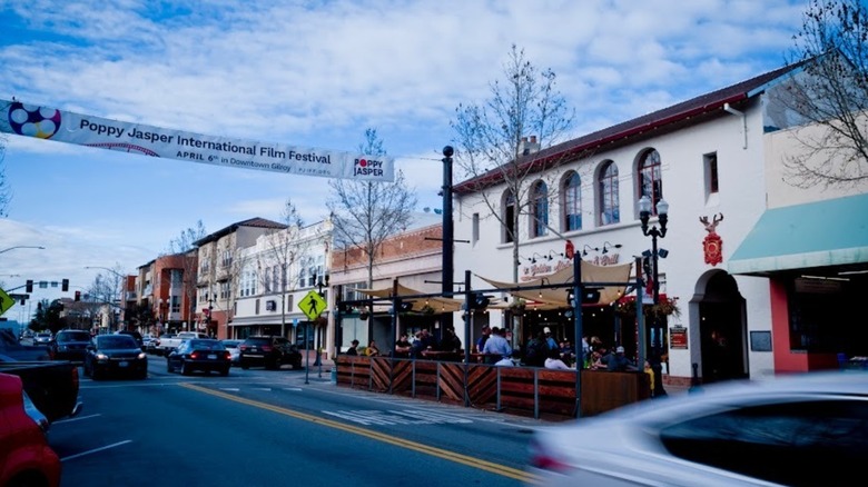 Street scene in Morgan Hill, CA, with over-road banner advertising the Poppy Jasper Film Festival