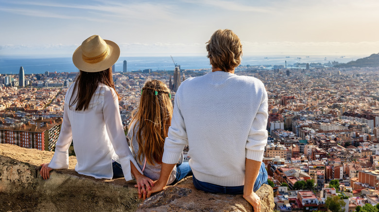 Family looking over a European city from above