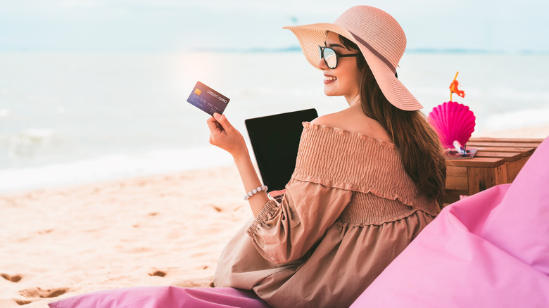 Woman paying for her trip