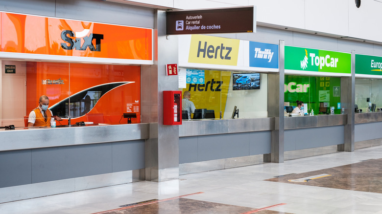 Car rental counters at an airport.
